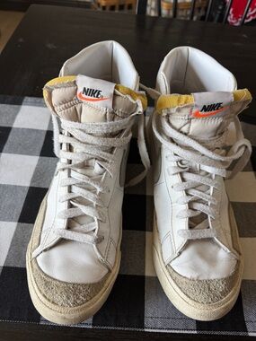 Nike White High-Top Sneakers with Yellow and Orange Details